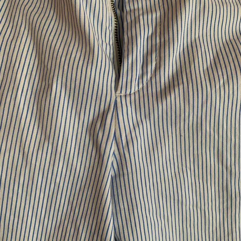 Shorts. White with small blue stripes.